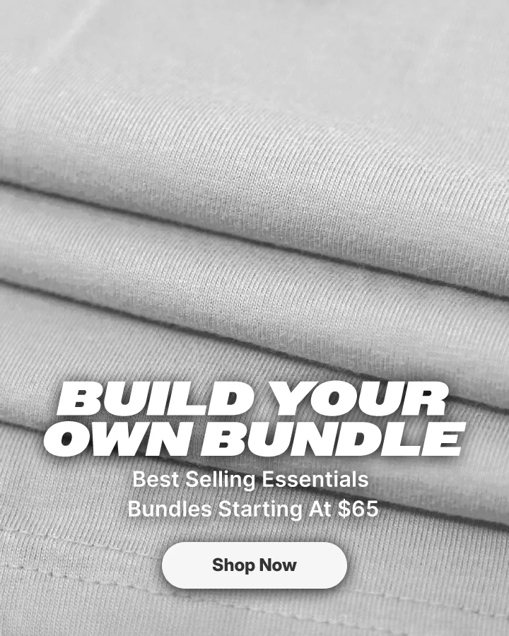 Promotional banner showing folded fabric swatches in light gray, black, and dark navy, with large white text reading 'BUILD YOUR OWN BUNDLE' and a small 'Shop Now' button.