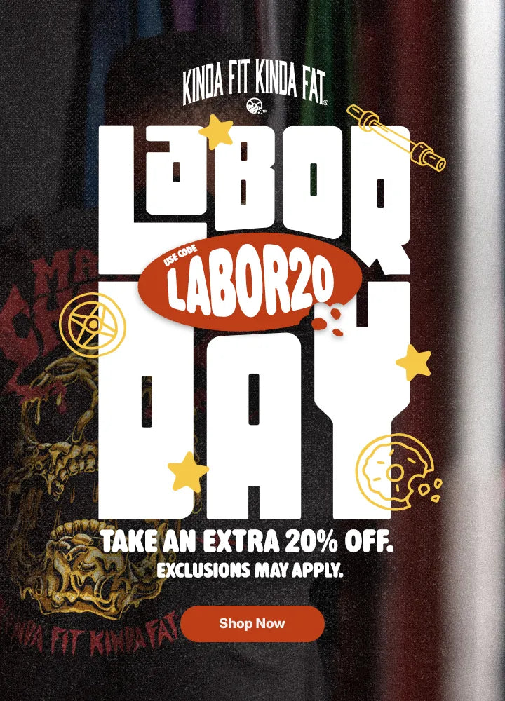 A promotional graphic for Labor Day featuring large white 'LABOR DAY' text over a dark bottle background, with an orange 'LABOR20' badge, yellow stars, and a 'Shop Now' button. Visible brand text at the top reads 'KINDA FIT KINDA FAT.